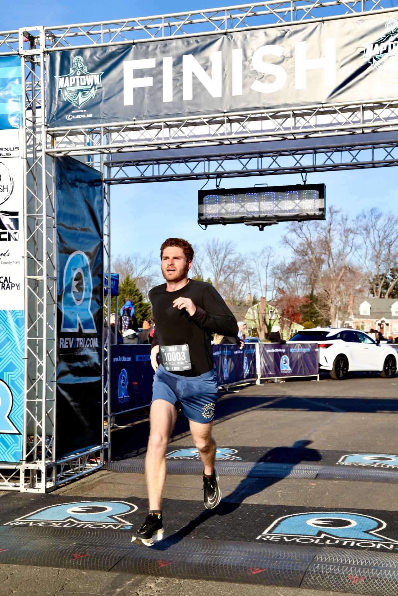 Sam crossing the finish line