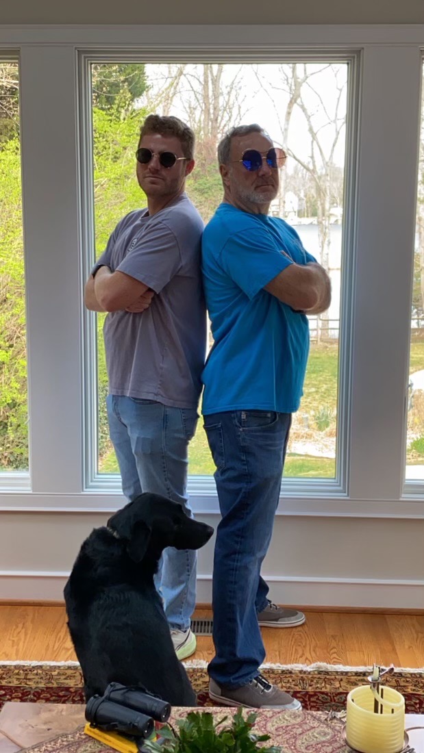 Frank and Sam back-to-back with the family dog